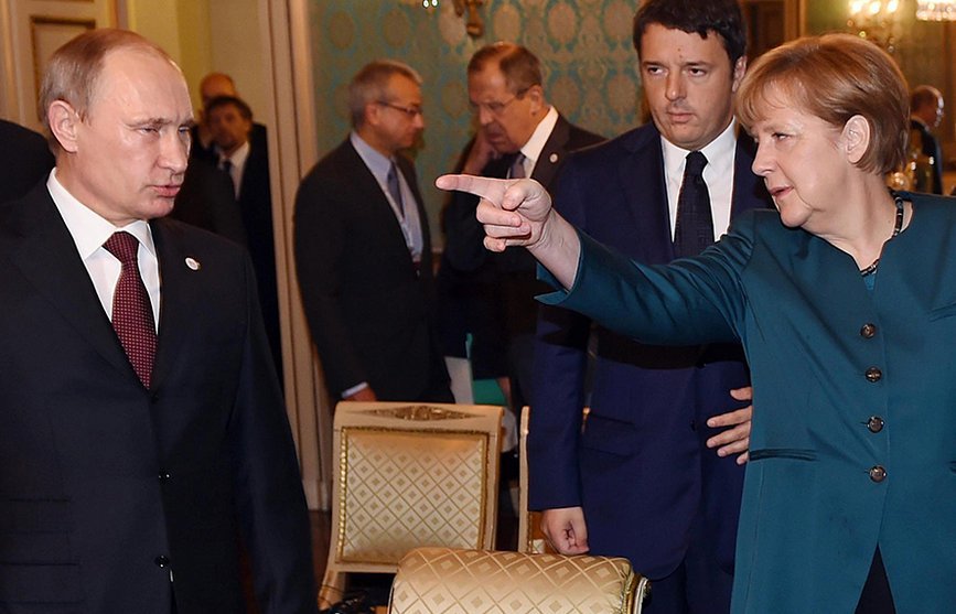 Vladimir Putin y Angela Merkel
